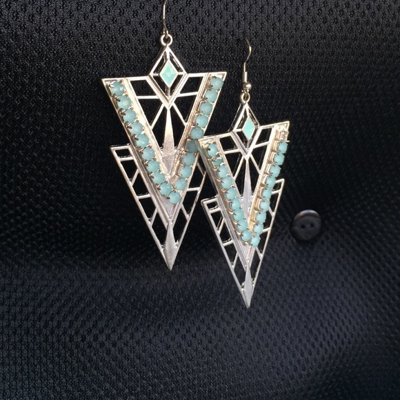Triangle hanging earrings with lite blue stones