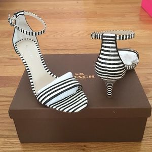 Black and white coach sandals