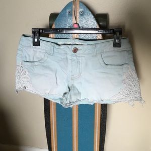Light blue short shorts with lace on the sides