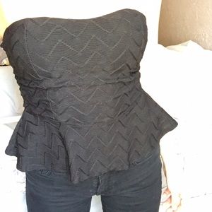 Strapless black peplum top