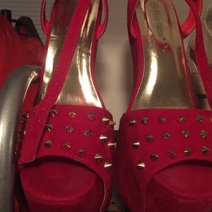 Heel less red spiky shoes