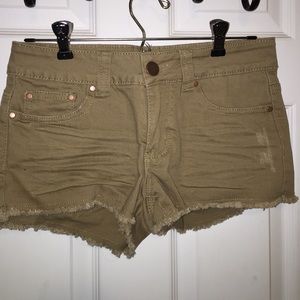 Taupe colored denim shorts.