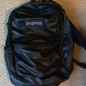 Faux leather jansport backpack.