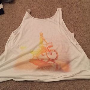 white tank with orange and yellow girl on bike