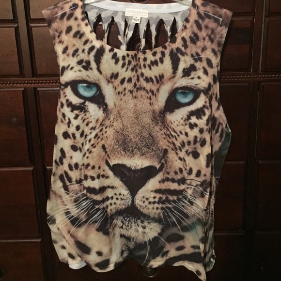 Sleeveless cheetah shirt . Also open back.