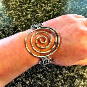 Silver spiral bracelet.