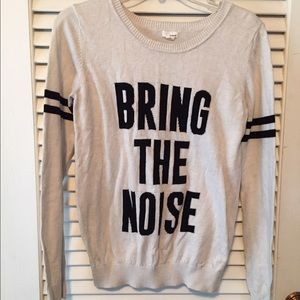 White "bring the noise" sweater