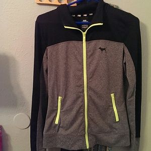 PINK jacket with neon green zippers.