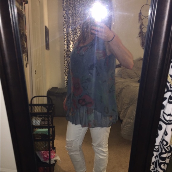 Sheer/ slightly shiny tank top.