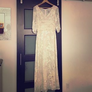 Beautiful full length dress. Beaded on the top.