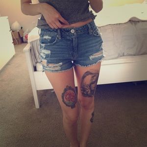 Midi distressed jean shorts.