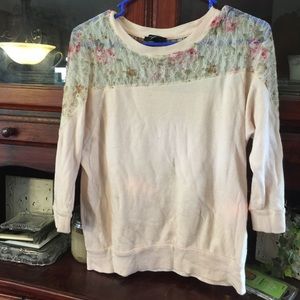 Pink blouse with lace yoke