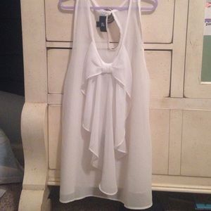 White see through tank with bow in front