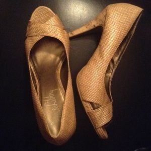 Tan golden open toe heels in good condition.