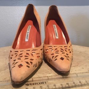 Peach Manolo Blahnik laser cut pumps.