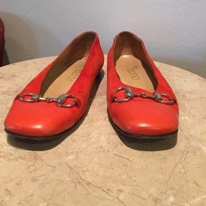 Orange leather and suede Gucci flats.