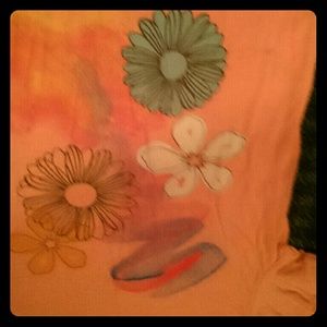 Pink t-shirt with flowers.