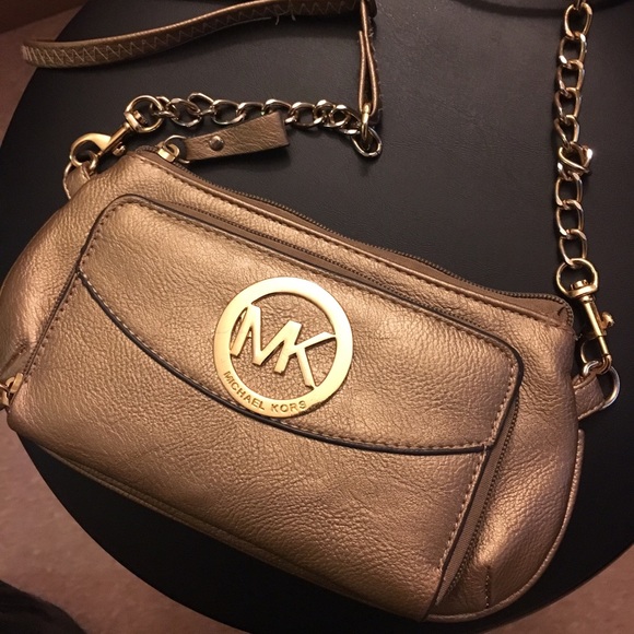 Gold MK cross bag.