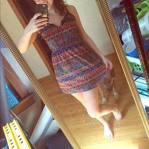 Multi colored chiffon dress w/ a see threw back.