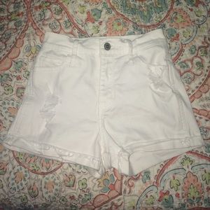 Destroyed white high wasted hollister shorts.