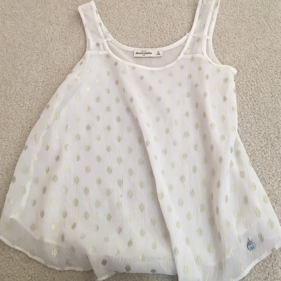 white and gold tank