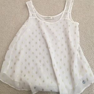 white and gold tank