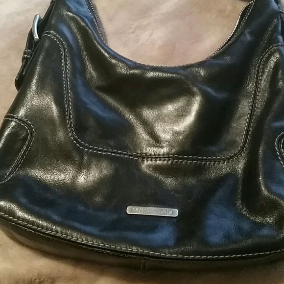 Used Michael Kors black leather purse.