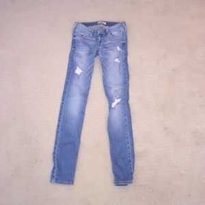 hollister lightwash jeans with several rips