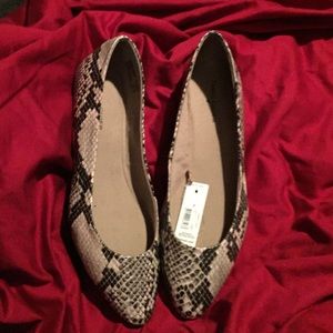 Very low snakeskin like shoes