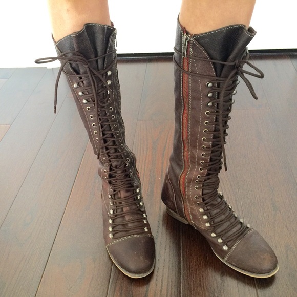 Steve Madden lace up leather boots.