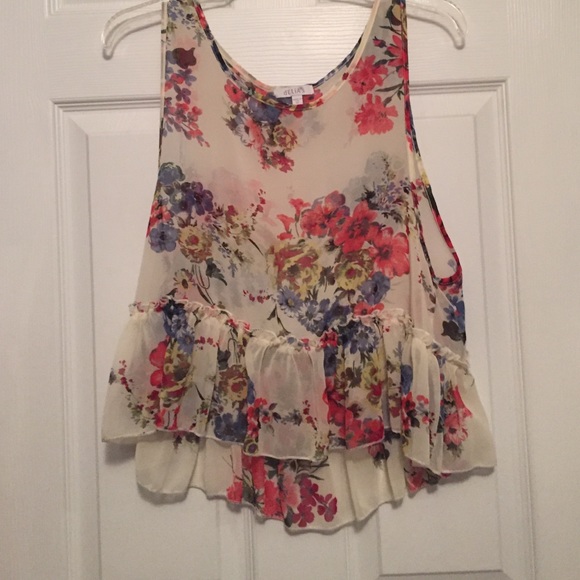 floral top with ruffle at bottom.