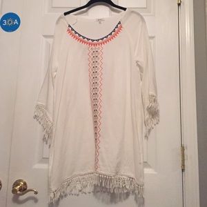 white long shirt with colorful design down middle