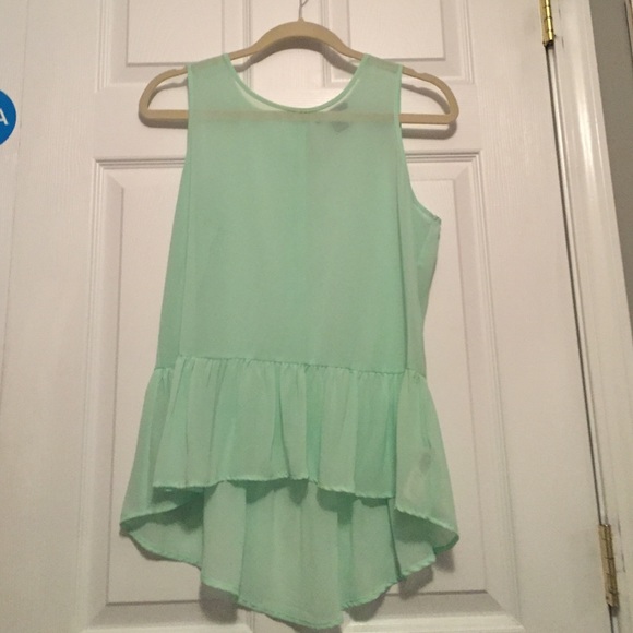Sea foam green tank with ruffle at bottom.