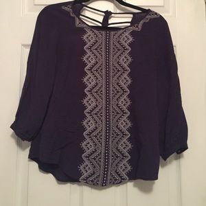 navy blue Blouse with design down middle.