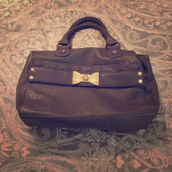 Large gray handbag with gold hardware.