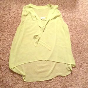 Lime green sleeveless blouse.