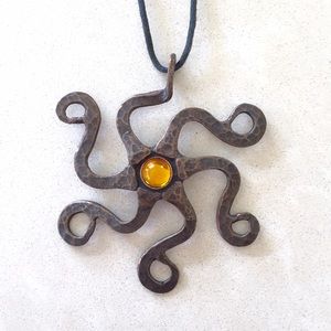 Hand-made bronze sea-star pendant with topaz gem