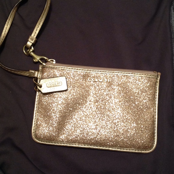 sparkly gold COACH wristlet