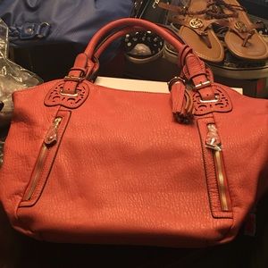 New. Rust burnt orange color bag.