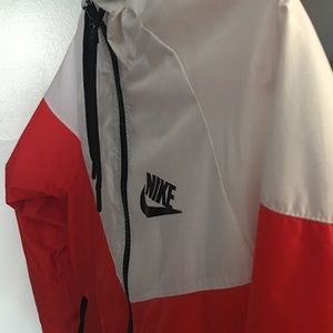 Red and white nike sweater.