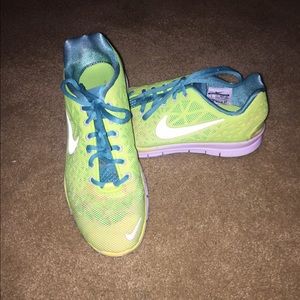 Teal and neon yellow Nike 5.0 running shoes