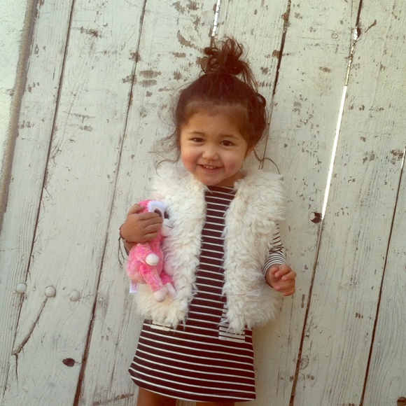 Fur sleeveless throw over .