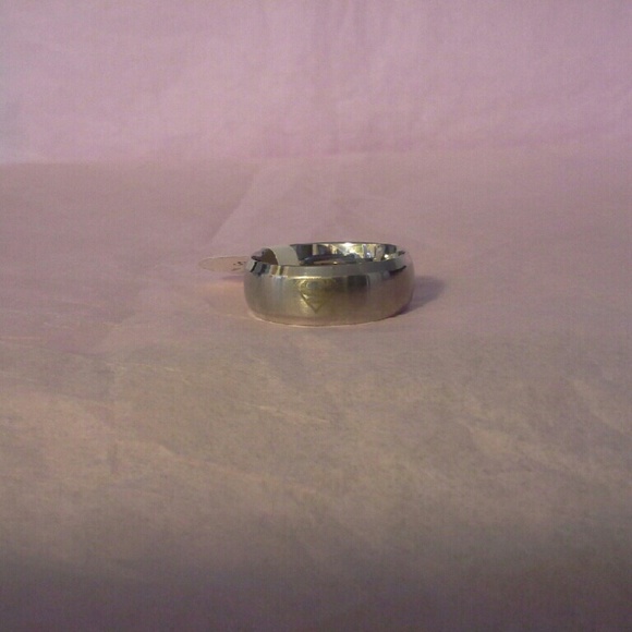 Silver colored superman rings