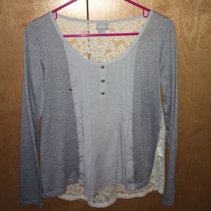 A gray shirt w/ a lace back & buttons in front 🤗