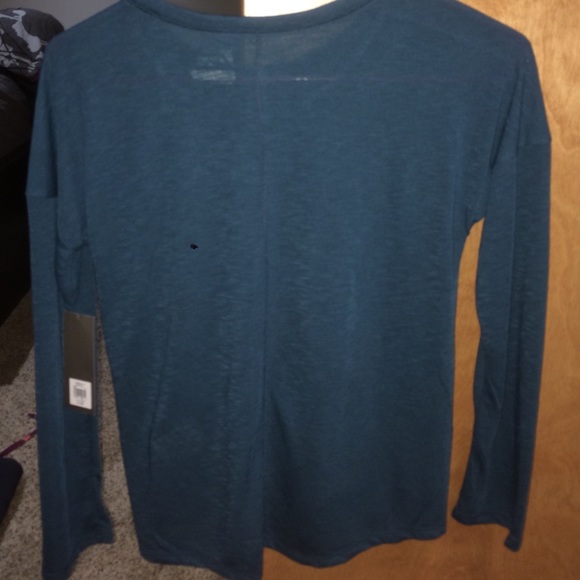 An aqua colored workout shirt (: - Picture 2 of 3