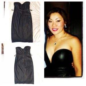 Black medium knee length pleather-like strapless.