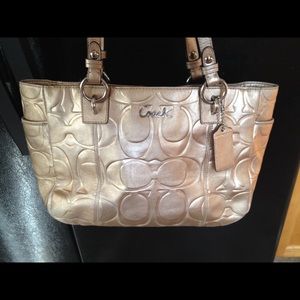 Gold coach purse