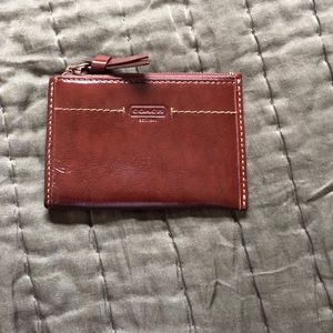 Coach brown patent leather card holder.
