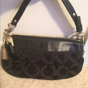 Small black Coach bag with gold trimming