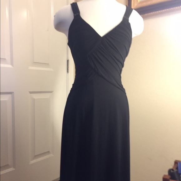 little black dress with black Leather purse.